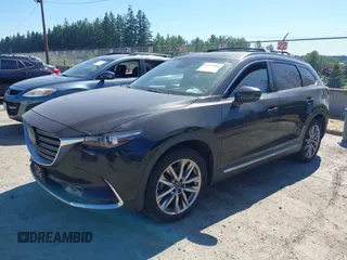 2018 Mazda CX-9 Grand Touring z VIN JM3TCBDY2J0237050, wystawiony jako IAAI lot #42457060 z przebiegiem 130 625 mil mil oraz . Historia ofert i sprzedaży dostępna na DreamBid. Obrazek 2.