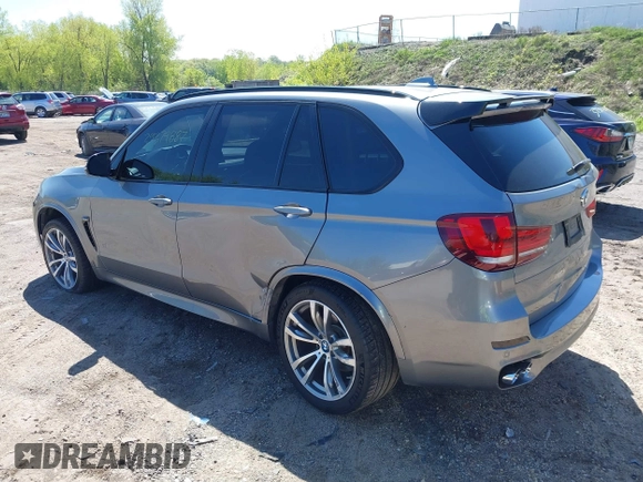2014 BMW X5 xDrive50i with VIN 5UXKR6C57E0J72301, listed as a IAAI auction lot 39379887 with 117,012 mi miles. Bid and sale history available at carsss.com. Image 3.