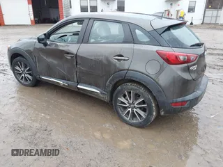 2016 Mazda CX-3 Grand Touring with VIN JM1DKBD77G0107328, listed as a IAAI auction lot 41682949 with 156,935 mi miles. Bid and sale history available at carsss.com. Image 3.