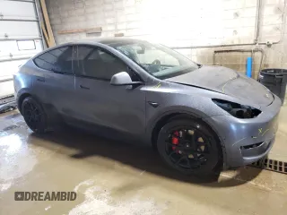 2021 Tesla Model Y Performance with VIN 5YJYGDEF2MF134700, listed as a Copart auction lot 56325685 with 66,730 mi miles and Salvage Title. Bid and sale history available at DreamBid. Image 4.