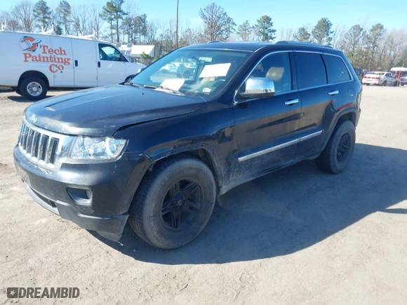 2011 Jeep Grand Cherokee Laredo with VIN 1J4RR4GG2BC585859, listed as a IAAI auction lot 41901919 with 272,585 mi miles. Bid and sale history available at carsss.com. Image 2.