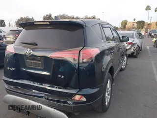 2018 Toyota RAV4 XLE with VIN JTMWFREV2JJ151595, listed as a IAAI auction lot 41380691 with 79,515 mi miles and . Bid and sale history available at carsss.com. Image 4.