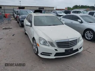 2012 Mercedes-Benz E E 350 Luxury with VIN WDDHF5KB9CA659728, listed as a IAAI auction lot 41948569 with 156,322 mi miles. Bid and sale history available at carsss.com. Image 1.