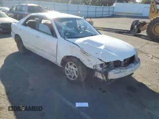 1999 Mazda 626 LX with VIN 1YVGF22D4X5882600, listed as a Copart auction lot 69031604 with 0 mi miles and Salvage Title. Bid and sale history available at carsss.com. Image 4.
