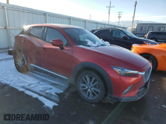 2016 Mazda CX-3 Grand Touring with VIN JM1DKBD78G0113185, listed as a Copart auction lot 42802145 with 158,068 mi miles and Salvage Title. Bid and sale history available at DreamBid. Image 4.