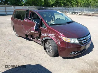 2014 Honda Odyssey Touring with VIN 5FNRL5H91EB099578, listed as a IAAI auction lot 42335752 with 190,467 mi miles and . Bid and sale history available at DreamBid. Image 1.