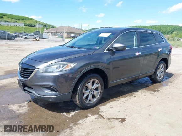 2014 Mazda CX-9 Touring with VIN JM3TB3CV9E0426767, listed as a IAAI auction lot 42301021 with 129,497 mi miles and . Bid and sale history available at DreamBid. Image 2.