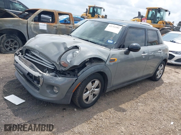 2015 MINI Hardtop 4 Door with VIN WMWXS5C56FT830418, listed as a IAAI auction lot 42132285 with 111,428 mi miles and . Bid and sale history available at DreamBid. Image 17.