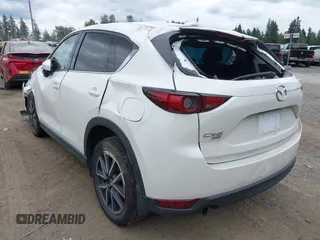 2018 Mazda CX-5 Grand Touring with VIN JM3KFBDM1J0382306, listed as a IAAI auction lot 42554947 with 121,303 mi miles and . Bid and sale history available at DreamBid. Image 3.