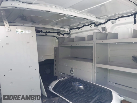 2023 Ford Transit Cargo with VIN 1FTBR1Y86PKA79798, listed as a IAAI auction lot 40155361 with 28,670 mi miles and . Bid and sale history available at DreamBid. Image 8.