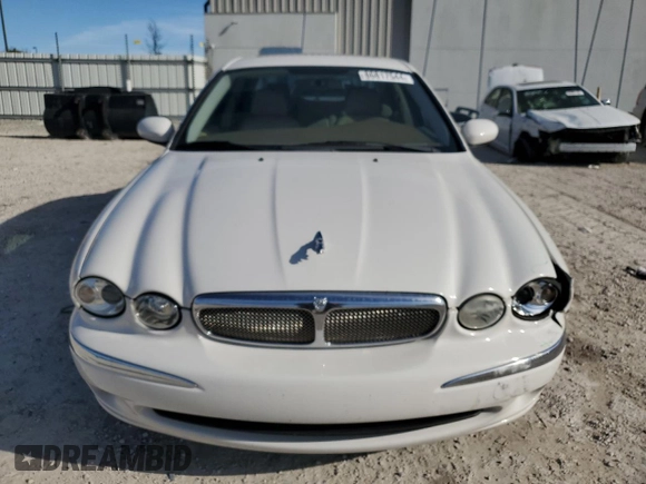 2007 Jaguar X-Type z VIN SAJWA51A67WJ24665, wystawiony jako Copart lot #86817544 z przebiegiem 52 027 mil mil oraz Szkoda całkowita • Salvage title. Historia ofert i sprzedaży dostępna na DreamBid. Obrazek 5.