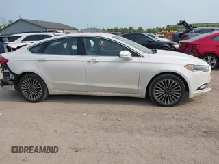 2017 Ford Fusion Titanium z VIN 3FA6P0K92HR396113, wystawiony jako IAAI lot #42402969 z przebiegiem 185 620 mil mil oraz . Historia ofert i sprzedaży dostępna na DreamBid. Obrazek 13.