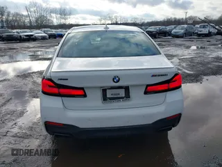 2021 BMW 5 Series M550i xDrive z VIN WBA13BK09MCF05866, wystawiony jako IAAI lot #41574859 z przebiegiem 37 822 mil mil oraz . Historia ofert i sprzedaży dostępna na DreamBid. Obrazek 16.