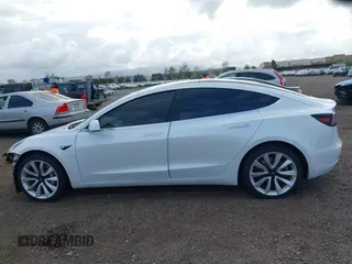 2019 Tesla Model 3 Long Range with VIN 5YJ3E1EBXKF512710, listed as a IAAI auction lot 42063737 with 90,721 mi miles and . Bid and sale history available at DreamBid. Image 15.