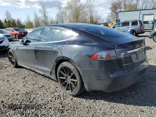 2016 Tesla Model S 90D with VIN 5YJSA1E2XGF150490, listed as a Copart auction lot 51070365 with 144,457 mi miles and Salvage Title. Bid and sale history available at DreamBid. Image 2.