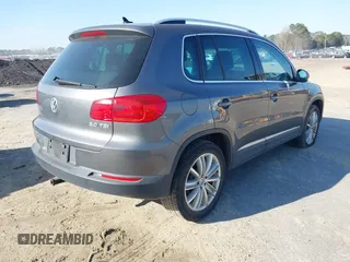 2012 Volkswagen Tiguan SE with VIN WVGAV7AX5CW000275, listed as a IAAI auction lot 41789246 with 123,618 mi miles and . Bid and sale history available at DreamBid. Image 4.