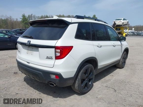 2021 Honda Passport Elite z VIN 5FNYF8H08MB014739, wystawiony jako IAAI lot #42137913 z przebiegiem 50 580 mil mil oraz . Historia ofert i sprzedaży dostępna na DreamBid. Obrazek 4.