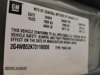 2003 Buick Regal LS z VIN 2G4WB52K731166956, wystawiony jako Copart lot #54233005 z przebiegiem 192 207 mil mil oraz Nie do naprawy • Non repairable. Historia ofert i sprzedaży dostępna na DreamBid. Obrazek 13.