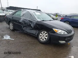 2003 Toyota Camry LE with VIN 4T1BE30K13U144114, listed as a IAAI auction lot 41829879 with 60,385 mi miles and . Bid and sale history available at DreamBid. Image 1.