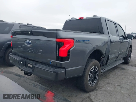 2023 Ford F-150 Lightning Pro with VIN 1FTVW1EL8PWG48559, listed as a IAAI auction lot 42033123 with 8,845 mi miles and . Bid and sale history available at DreamBid. Image 4.