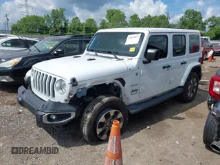 2018 Jeep Wrangler Unlimited Sahara with VIN 1C4HJXEG1JW205789, listed as a IAAI auction lot 42435877 with 57,587 mi miles and . Bid and sale history available at DreamBid. Image 18.