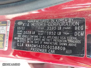 2012 Kia Rio LX with VIN KNADM5A35C6058809, listed as a IAAI auction lot 42052025 with 124,266 mi miles. Bid and sale history available at carsss.com. Image 9.