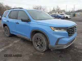 2023 Honda Pilot TrailSport z VIN 5FNYG1H61PB048082, wystawiony jako IAAI lot #41653501 z przebiegiem 37 709 mil mil oraz . Historia ofert i sprzedaży dostępna na DreamBid. Obrazek 1.