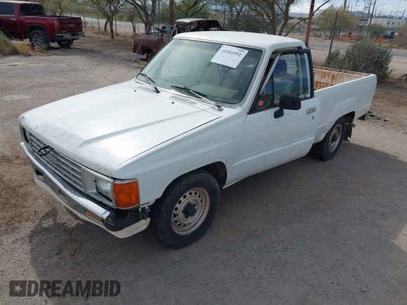 1991 Toyota Pickup DX z VIN JT4RN81P8M5123864, wystawiony jako IAAI lot #38084991 z przebiegiem 319 627 mil mil oraz . Historia ofert i sprzedaży dostępna na DreamBid. Obrazek 2.