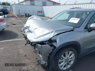 2014 Mazda CX-5 Grand Touring with VIN JM3KE4DY9E0375014, listed as a IAAI auction lot 42000382 with 110,584 mi miles and . Bid and sale history available at DreamBid. Image 18.