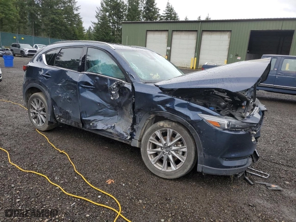 2021 Mazda CX-5 Grand Touring Reserve with VIN JM3KFBAY3M0327707, listed as a Copart auction lot 49733255 with 34,084 mi miles and Salvage Title. Bid and sale history available at carsss.com. Image 4.