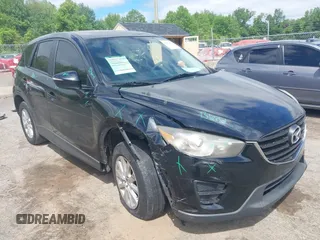 2016 Mazda CX-5 Sport z VIN JM3KE4BY4G0633137, wystawiony jako IAAI lot #42313017 z przebiegiem 127 704 mil mil oraz . Historia ofert i sprzedaży dostępna na DreamBid. Obrazek 1.
