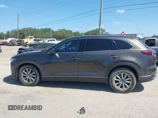 2019 Mazda CX-9 Touring with VIN JM3TCACY9K0304899, listed as a IAAI auction lot 42167180 with 57,043 mi miles and . Bid and sale history available at DreamBid. Image 14.
