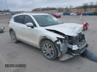 2023 Mazda CX-5 2.5 S Premium Plus Package with VIN JM3KFBEMXP0103278, listed as a IAAI auction lot 40954999 with 100,798 mi miles. Bid and sale history available at carsss.com. Image 1.