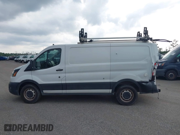 2020 Ford Transit Cargo with VIN 1FTBR1Y8XLKA19646, listed as a IAAI auction lot 42633323 with 82,577 mi miles and . Bid and sale history available at DreamBid. Image 14.