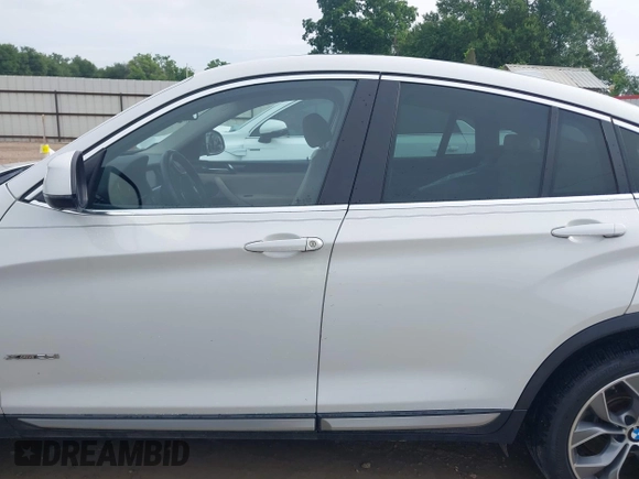 2015 BMW X4 xDrive28i with VIN 5UXXW3C51F0M86668, listed as a IAAI auction lot 42489071 with 59,694 mi miles and . Bid and sale history available at DreamBid. Image 15.