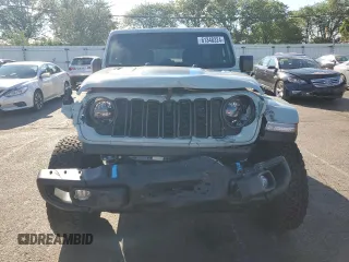 2024 Jeep Wrangler Rubicon z VIN 1C4RJXR64RW279791, wystawiony jako Copart lot #61348324 z przebiegiem 1 387 mil mil oraz Szkoda całkowita • Salvage title. Historia ofert i sprzedaży dostępna na DreamBid. Obrazek 5.