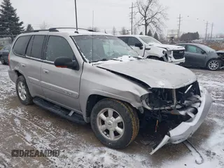 2005 GMC Envoy SLT with VIN 1GKDT13S352258640, listed as a IAAI auction lot 41226997 with 159,665 mi miles. Bid and sale history available at carsss.com. Image 1.