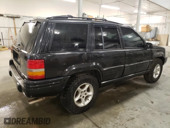 1998 Jeep Grand Cherokee Limited with VIN 1J4GZ88Z3WC165659, listed as a Copart auction lot 87527255 with 203,860 mi miles and Salvage Title. Bid and sale history available at carsss.com. Image 3.