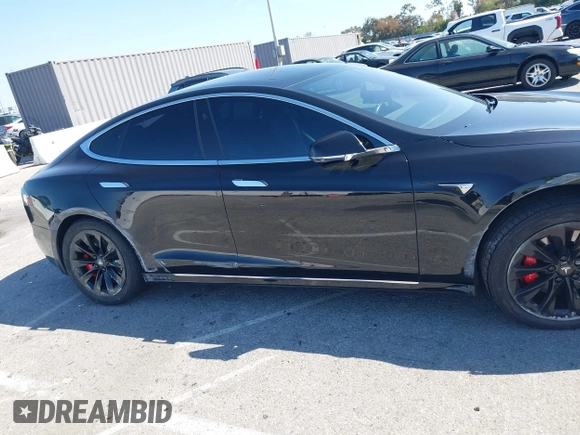 2017 Tesla Model S 100D with VIN 5YJSA1E21HF202591, listed as a IAAI auction lot 41983073 with 140,282 mi miles and . Bid and sale history available at DreamBid. Image 13.