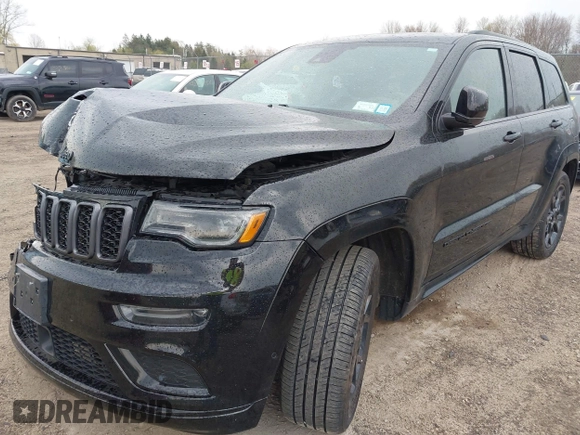 2021 Jeep Grand Cherokee 80th Anniversary with VIN 1C4RJFBG7MC828116, listed as a IAAI auction lot 42118355 with 57,240 mi miles and . Bid and sale history available at DreamBid. Image 18.