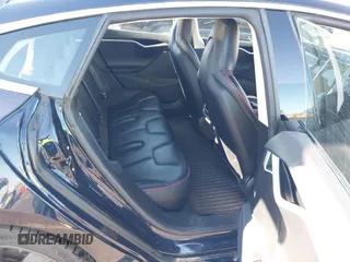 2014 Tesla Model S 60 with VIN 5YJSA1H14EFP57209, listed as a IAAI auction lot 41305157 with 141,364 mi miles and . Bid and sale history available at DreamBid. Image 8.