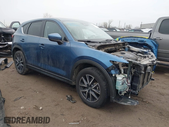 2017 Mazda CX-5 Grand Touring with VIN JM3KFADL9H0187338, listed as a IAAI auction lot 41382034 with 141,972 mi miles and . Bid and sale history available at carsss.com. Image 1.