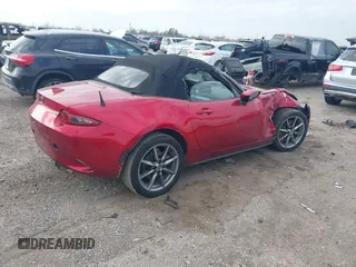 2021 Mazda MX-5 Miata Grand Touring with VIN JM1NDAD79M0454079, listed as a IAAI auction lot 41230199 with 104,783 mi miles and . Bid and sale history available at DreamBid. Image 4.