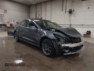 2020 Tesla Model 3 Long Range z VIN 5YJ3E1EB0LF800804, wystawiony jako IAAI lot #42137223 z przebiegiem 52 482 mil mil oraz . Historia ofert i sprzedaży dostępna na DreamBid. Obrazek 1.