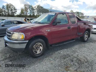 1997 Ford F-150 XL with VIN 1FTDX0723VKB85872, listed as a Copart auction lot 73927034 with 210,577 mi miles and Salvage title. Bid and sale history available at DreamBid. Image 1.