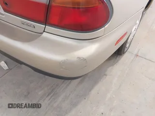 1997 Mazda Protege DX z VIN JM1BC1415V0133823, wystawiony jako IAAI lot #42091960 z przebiegiem 149 959 mil mil oraz . Historia ofert i sprzedaży dostępna na DreamBid. Obrazek 6.