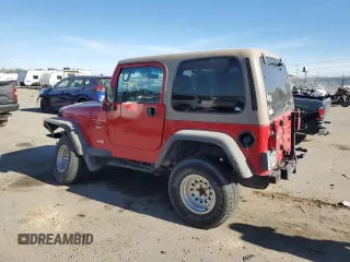 2000 Jeep Wrangler Sport with VIN 1J4FA49S1YP703560, listed as a Copart auction lot 73647844 with 117,300 mi miles and Salvage Title. Bid and sale history available at carsss.com. Image 2.