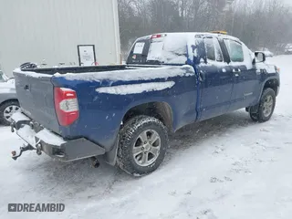 2014 Toyota Tundra 4WD Truck SR with VIN 5TFUY5F18EX392859, listed as a IAAI auction lot 41264709 with 186,881 mi miles. Bid and sale history available at carsss.com. Image 4.