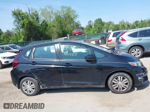 2015 Honda Fit LX z VIN 3HGGK5H51FM724566, wystawiony jako IAAI lot #42151755 z przebiegiem 168 744 mil mil oraz . Historia ofert i sprzedaży dostępna na DreamBid. Obrazek 13.