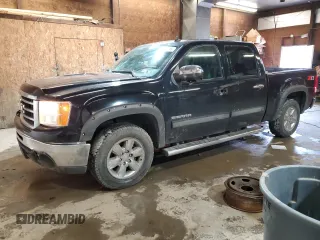 2012 GMC Sierra 1500 SLT with VIN 3GTP2WE78CG151900, listed as a Copart auction lot 59606695 with 124,388 mi miles and Salvage title. Bid and sale history available at DreamBid. Image 1.